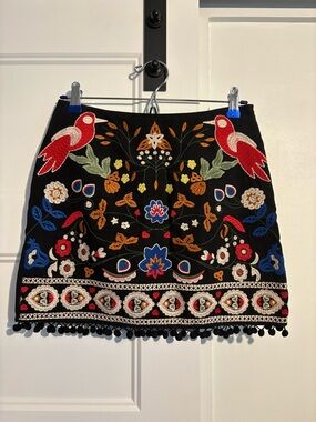 Umgee Black Mini Skirt with Multicolor Embroidered Birds & Pom Trim